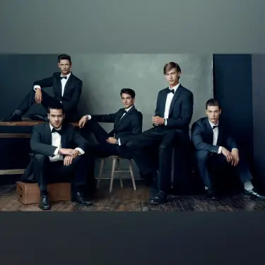 Timeless elegant gentlemens group portrait in tuxedos